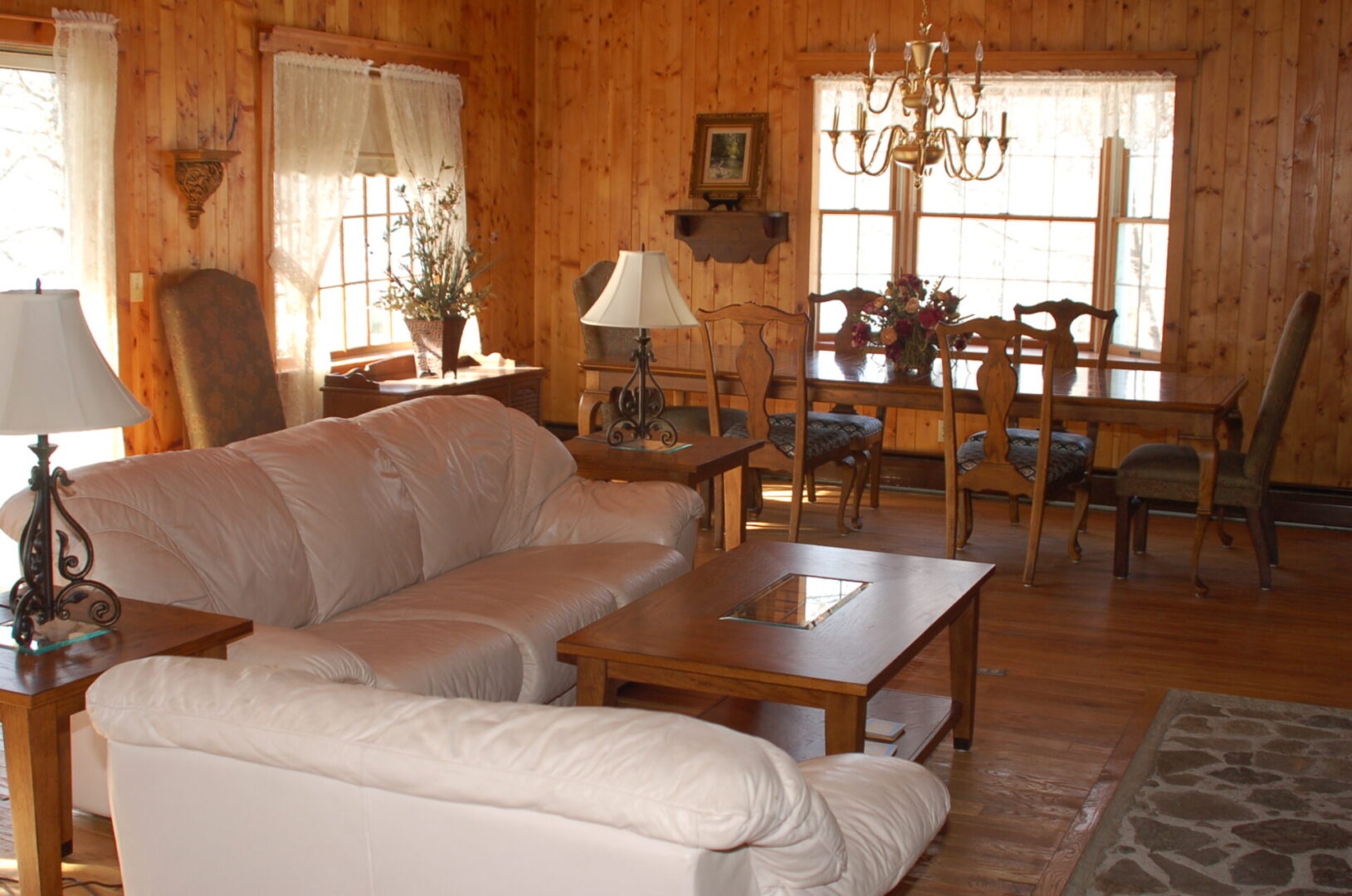 Living room with a white couch and table.